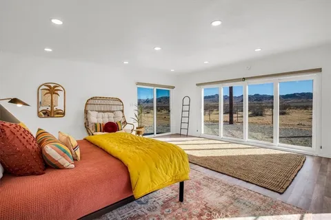 a view of front door with a rug
