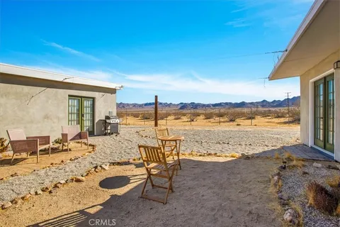 a view of a terrace with chairs