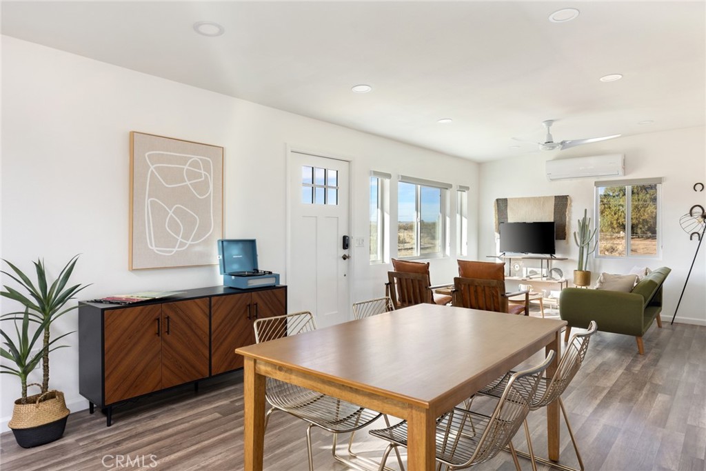 5737 Mojave Ranch Road Joshua Tree, CA 92252 - Photo 4 of 47 a view of a dining room with furniture and wooden floor