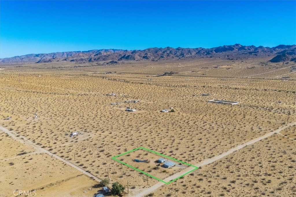 5737 Mojave Ranch Road Joshua Tree, CA 92252 - Photo 43 of 47 a view of an empty room and mountain view