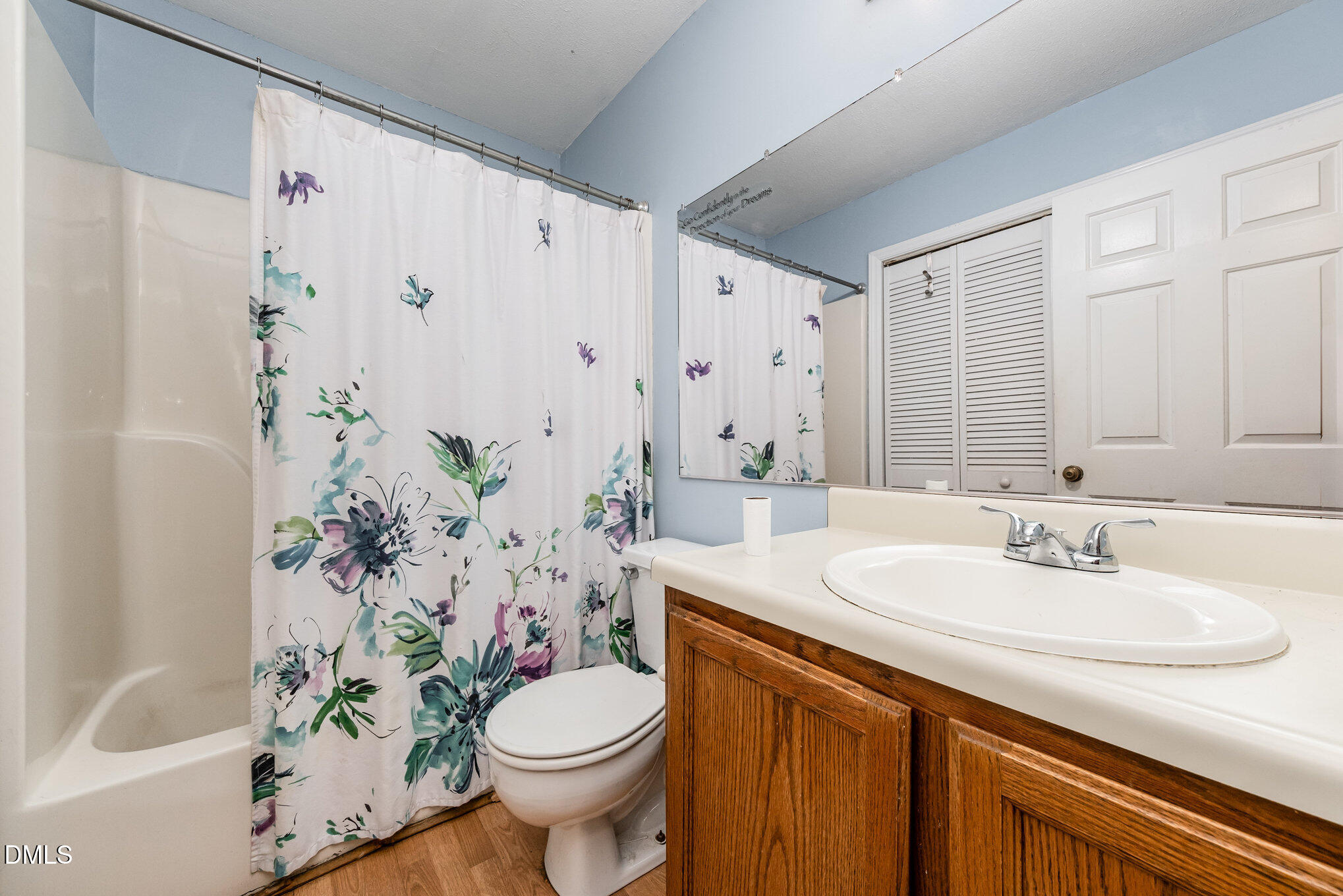 153 Abercrombie Road Wake Forest, NC 27587 - Photo 12 of 18 a bathroom with a sink a toilet and tub
