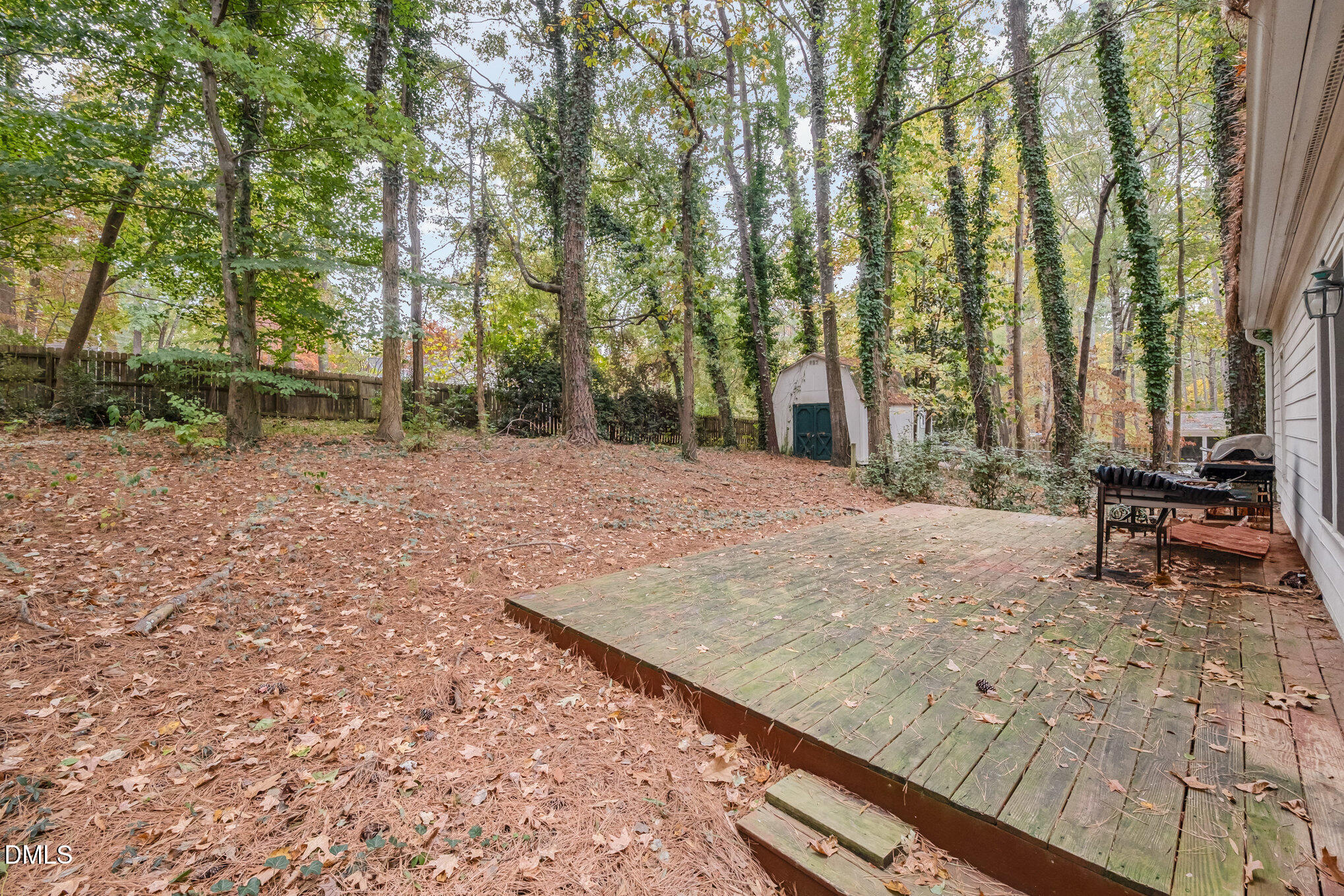 153 Abercrombie Road Wake Forest, NC 27587 - Photo 13 of 18 a view of a backyard with sitting area