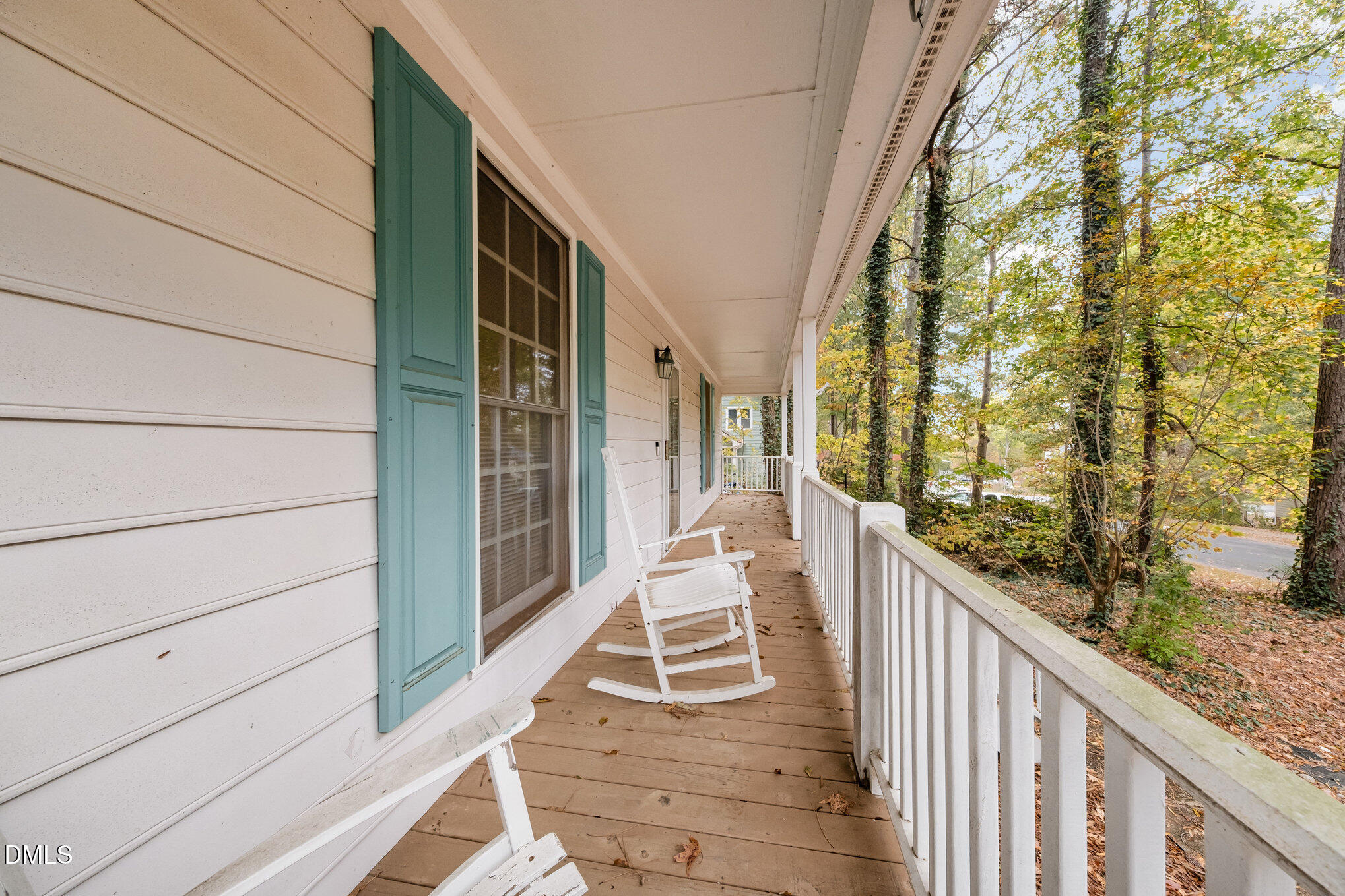 153 Abercrombie Road Wake Forest, NC 27587 - Photo 2 of 18 a balcony view with large trees