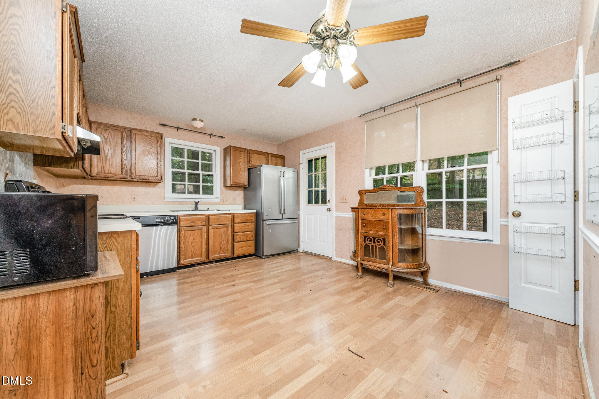 153 Abercrombie Road Wake Forest, NC 27587 - Photo 9 of 18 a view of a kitchen with a sink cabinets and a kitchen