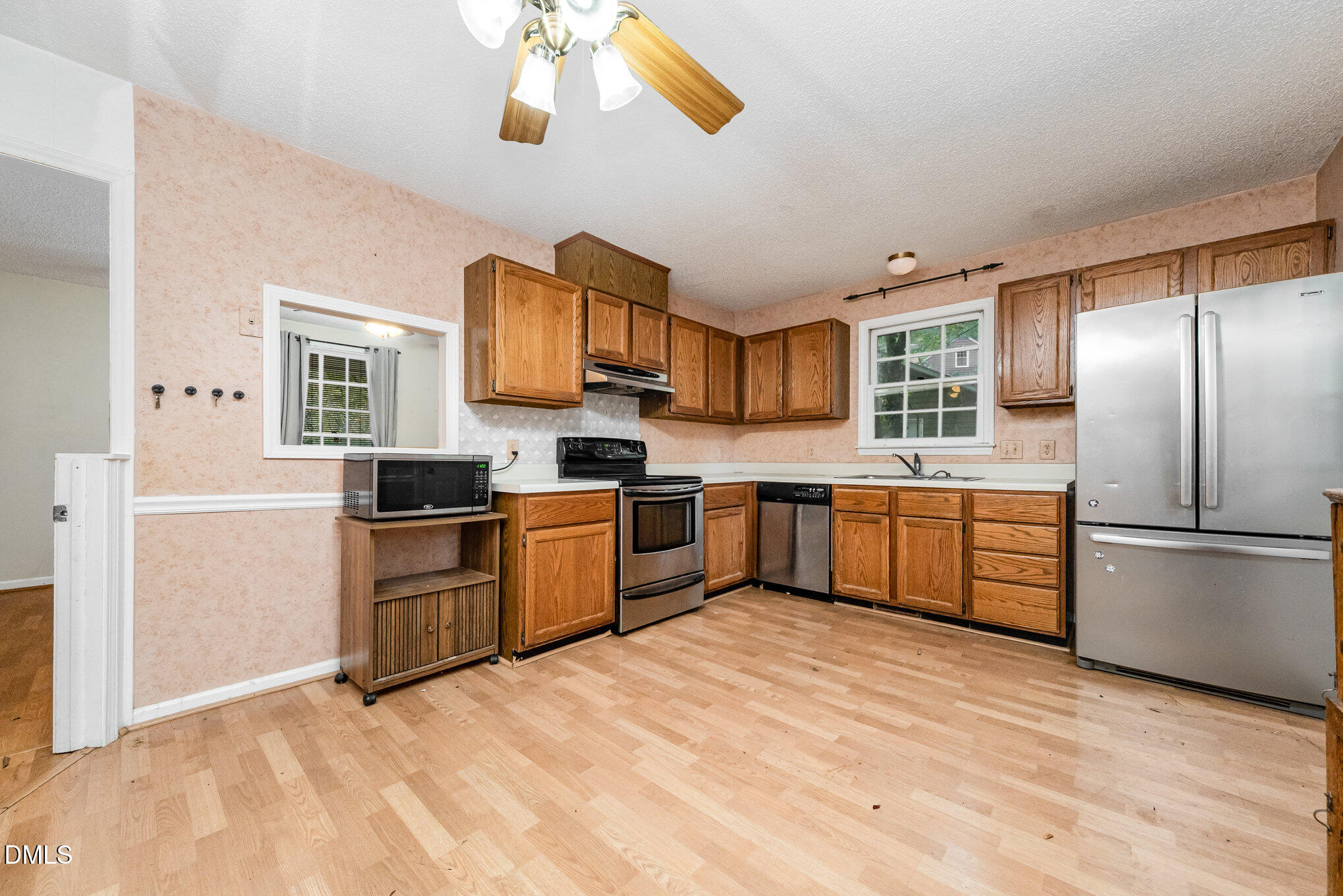 153 Abercrombie Road Wake Forest, NC 27587 - Photo 10 of 18 a kitchen with stainless steel appliances granite countertop a refrigerator sink and cabinets