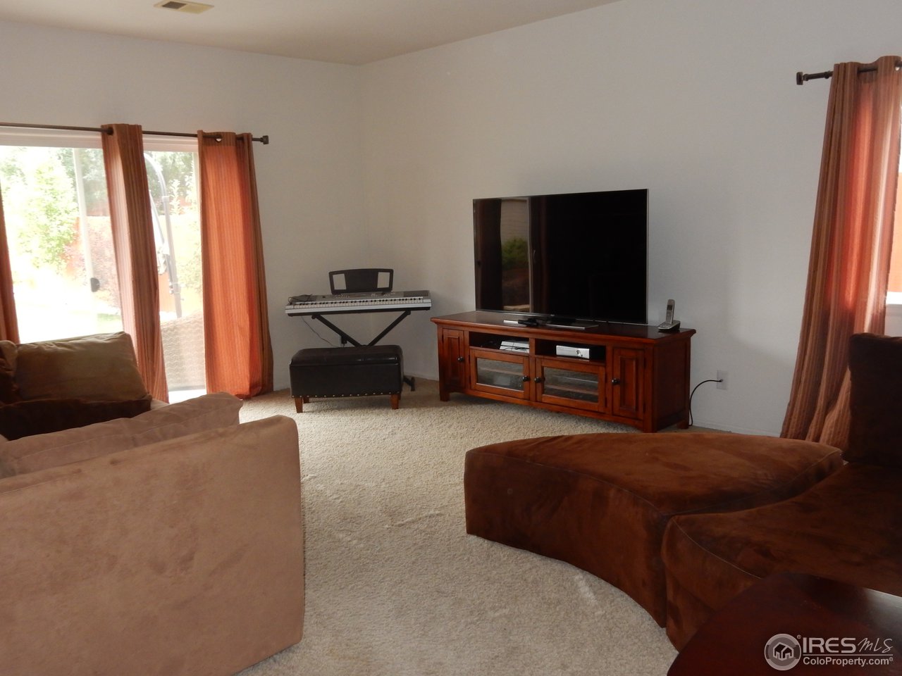 8712 18th St Road Greeley, CO 80634 - Photo 13 of 22 Family Room