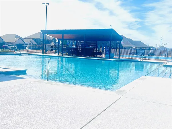 a view of a lake with a house in the background