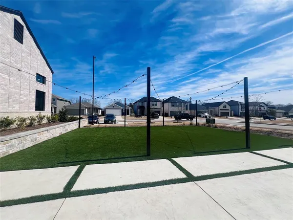 a view of a garden with lawn chairs
