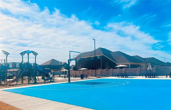 a front view of a house with yard and trees