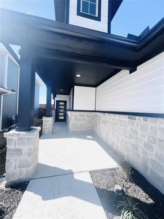 a view of living room with furniture and wooden floor