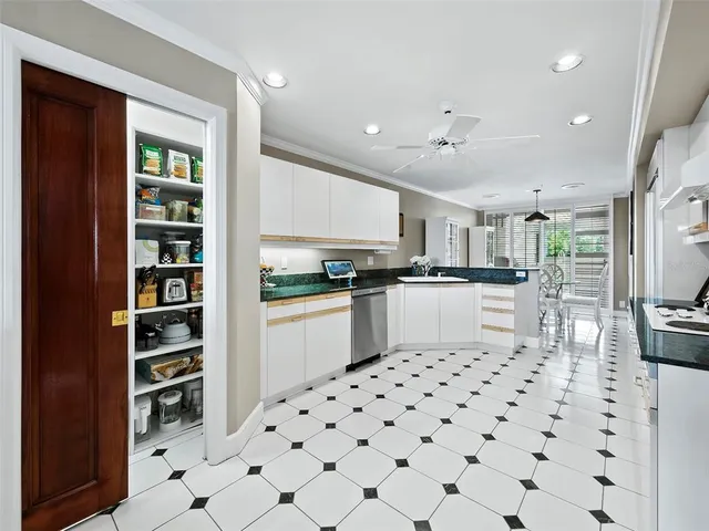 a bedroom with a large bed and a flat screen tv on dresser