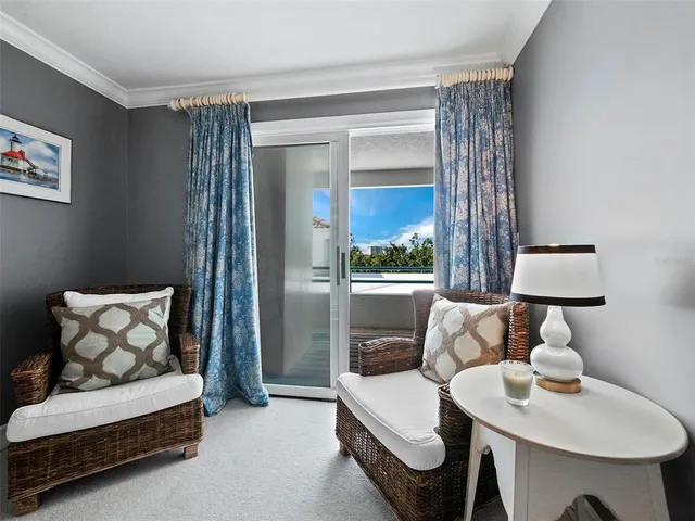 a view of swimming pool with outdoor seating and plants