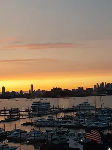 a view of a room that has a bed and a window