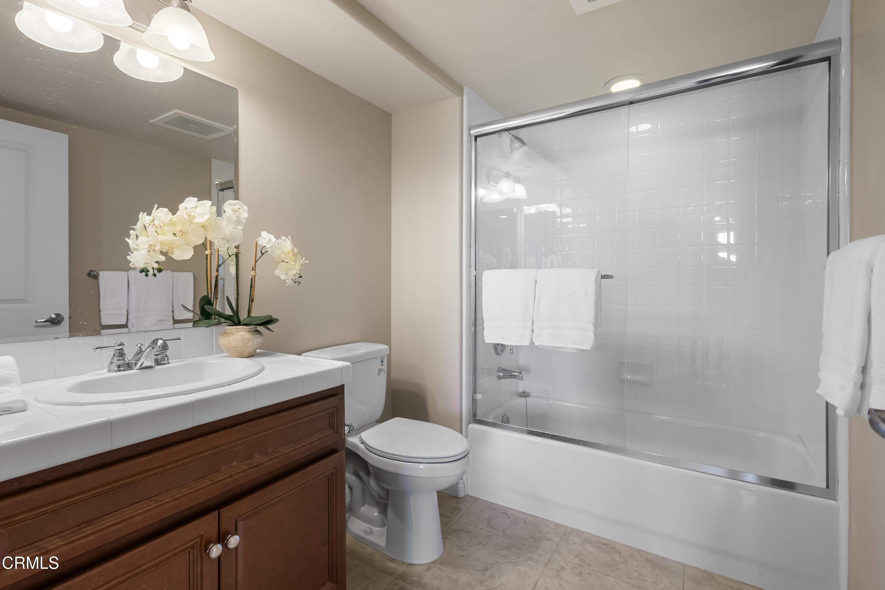 4282 Tradewinds Drive Oxnard, CA 93035 - Photo 13 of 29 a bathroom with a sink a toilet and shower