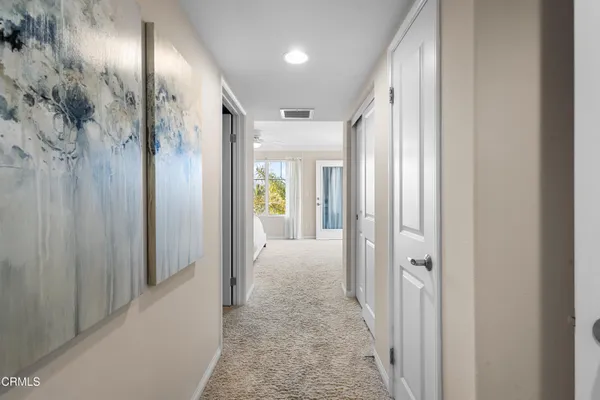 a view of hallway with livingroom