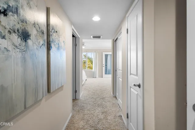 a view of hallway with livingroom