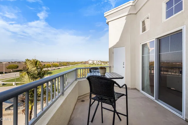 a view of a balcony with chairs