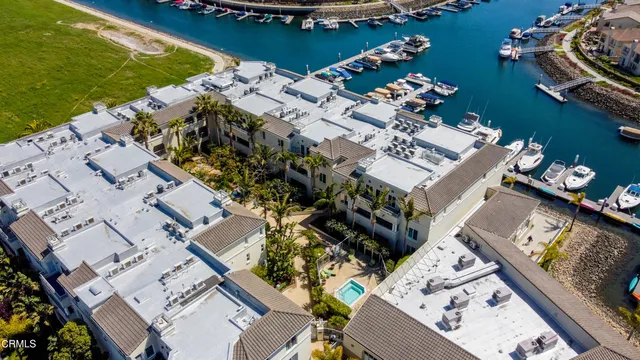 an aerial view of a house with a ocean view