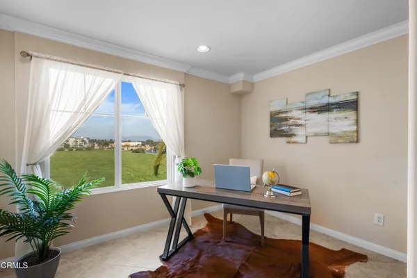 a workspace with furniture and a window