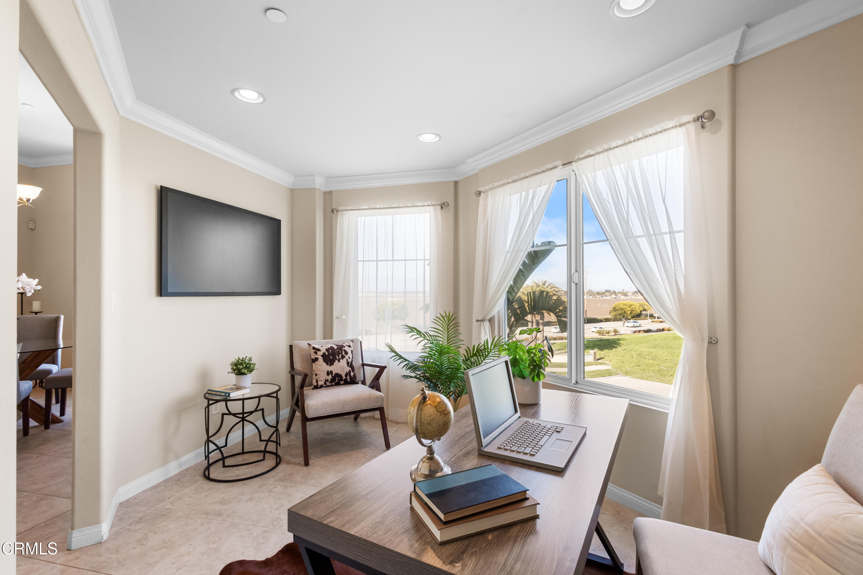 4282 Tradewinds Drive Oxnard, CA 93035 - Photo 9 of 29 a living room with furniture and a flat screen tv