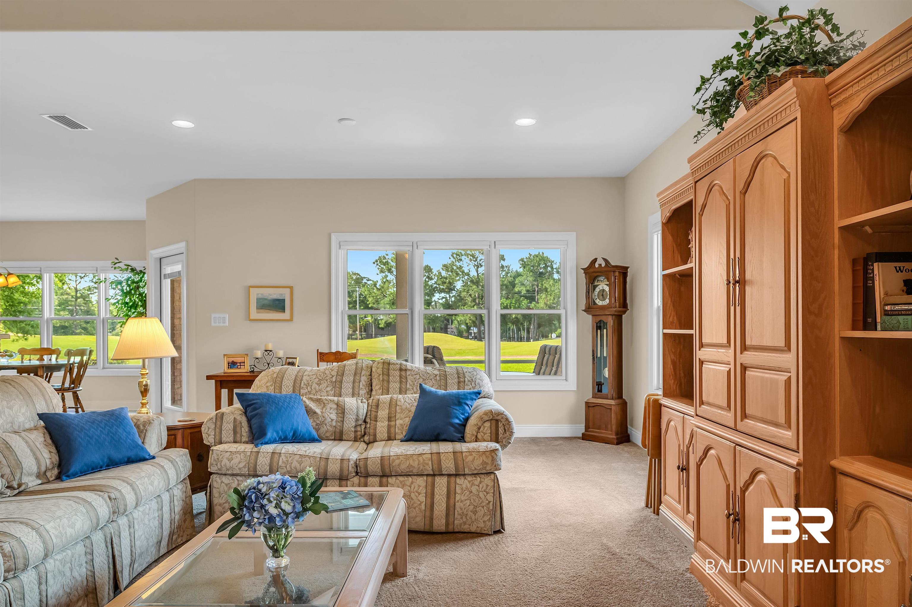 22739 Inverness Way Foley, AL 36535 - Photo 23 of 80 Living area featuring light carpet, plenty of natural light, baseboards, and recessed lighting
