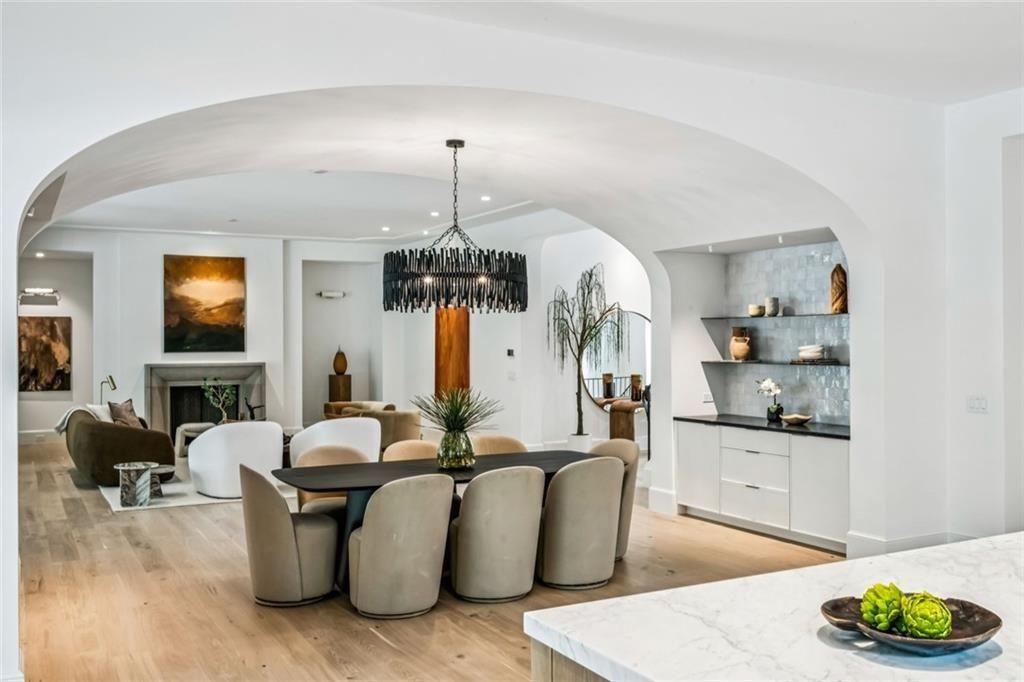 3167 Rilman Road Northwest Atlanta, GA 30327 - Photo 17 of 52 a living room with furniture kitchen view and a chandelier