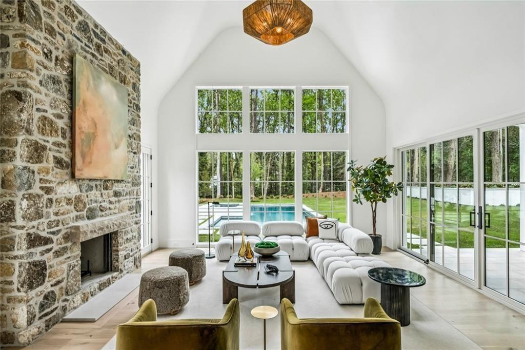 3167 Rilman Road Northwest Atlanta, GA 30327 - Photo 18 of 52 a living room with furniture and a floor to ceiling window