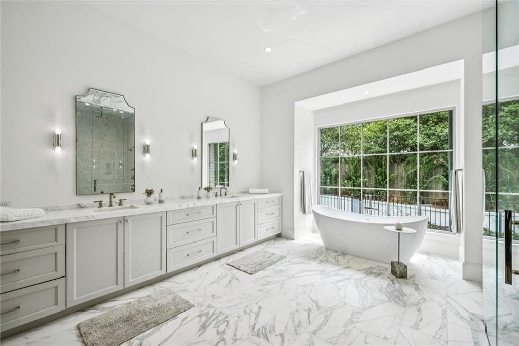 3167 Rilman Road Northwest Atlanta, GA 30327 - Photo 25 of 52 a large white bathroom with a granite countertop sink and a large mirror