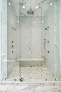 a bathroom with double sink and a mirror