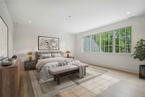 a bedroom with a bed and a couch