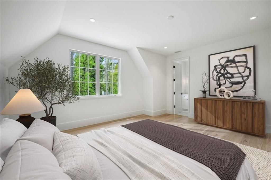 3167 Rilman Road Northwest Atlanta, GA 30327 - Photo 37 of 52 a bedroom with a bed and a couch