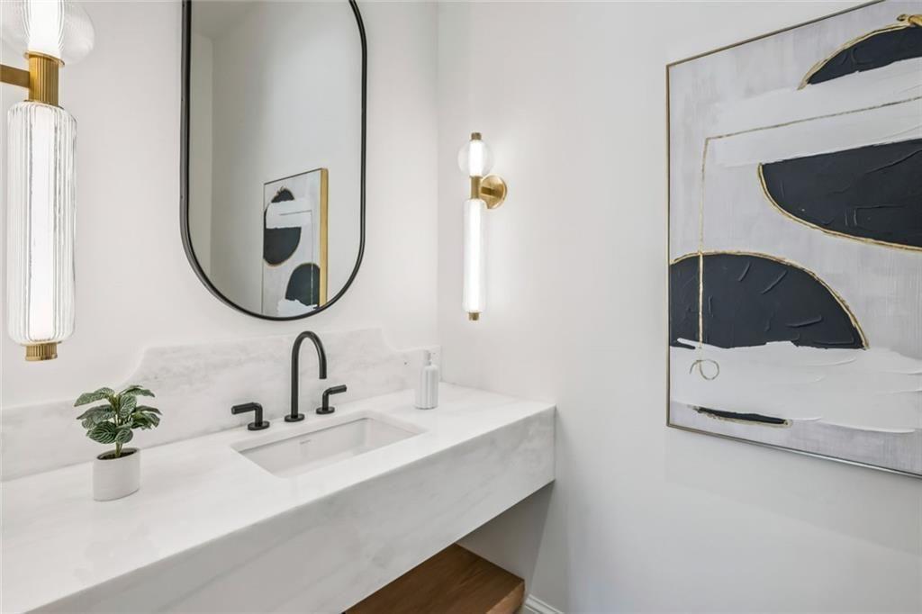 3167 Rilman Road Northwest Atlanta, GA 30327 - Photo 8 of 52 a bathroom with a sink and a mirror