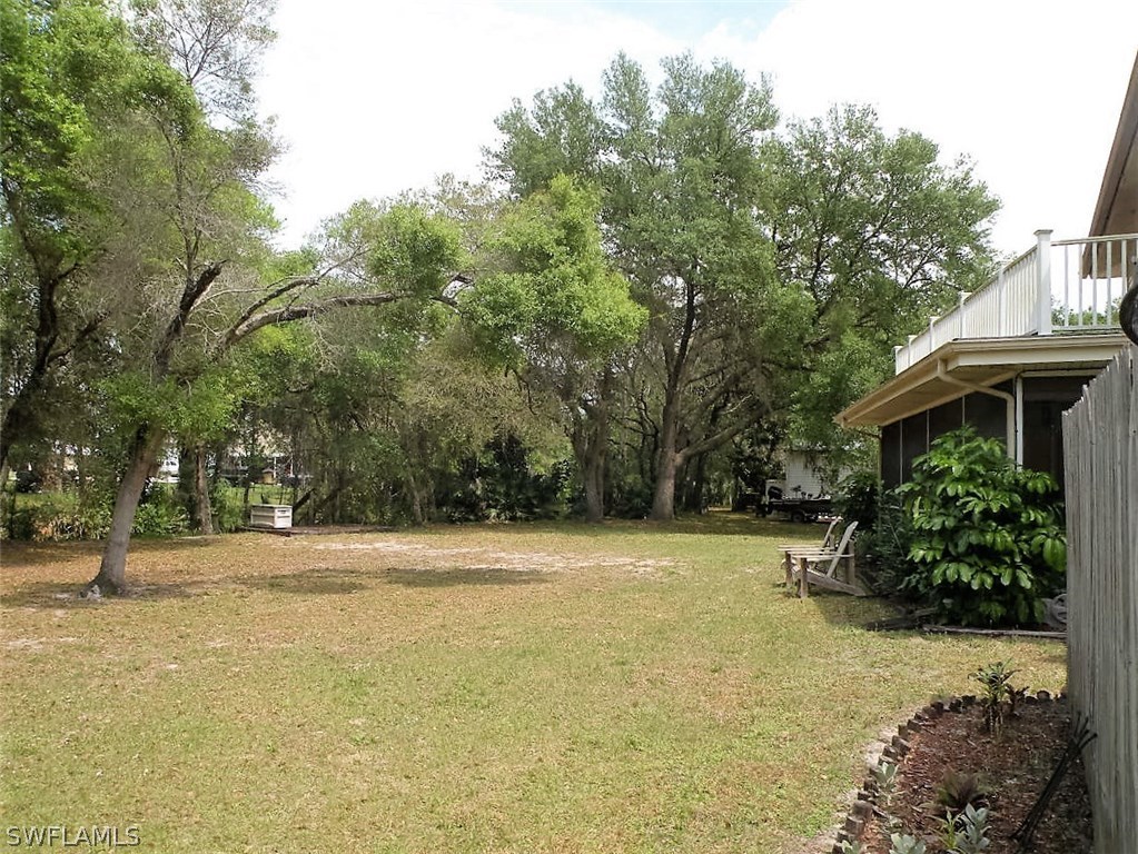 17571 Frank Road Alva, FL 33920 - Photo 5 of 13 a view of a garden with trees