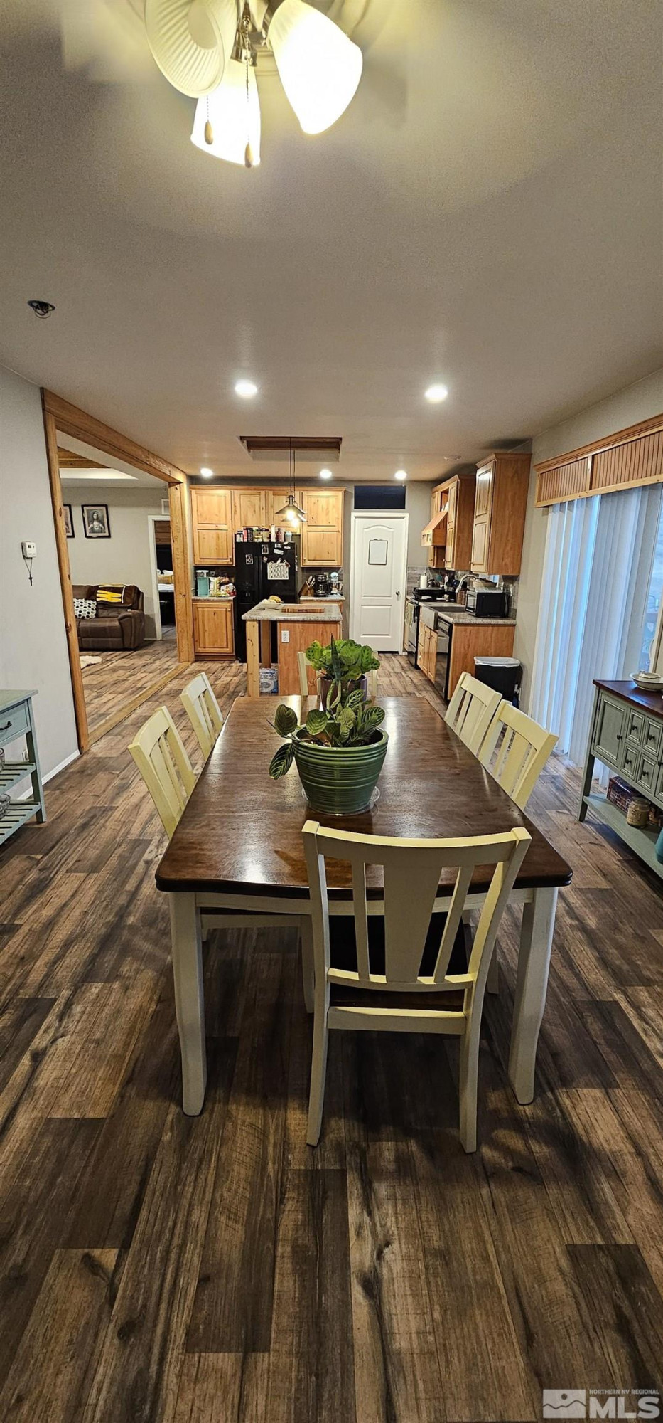 116 Victorine Drive Kingston, NV 89310 - Photo 15 of 25 a kitchen with stainless steel appliances a stove a table and chairs
