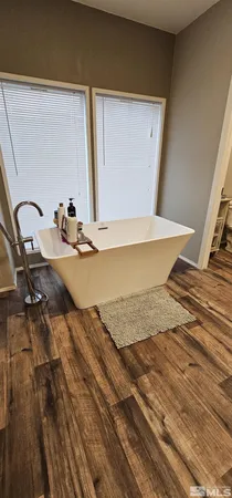 a bathroom with a double vanity sink toilet and shower