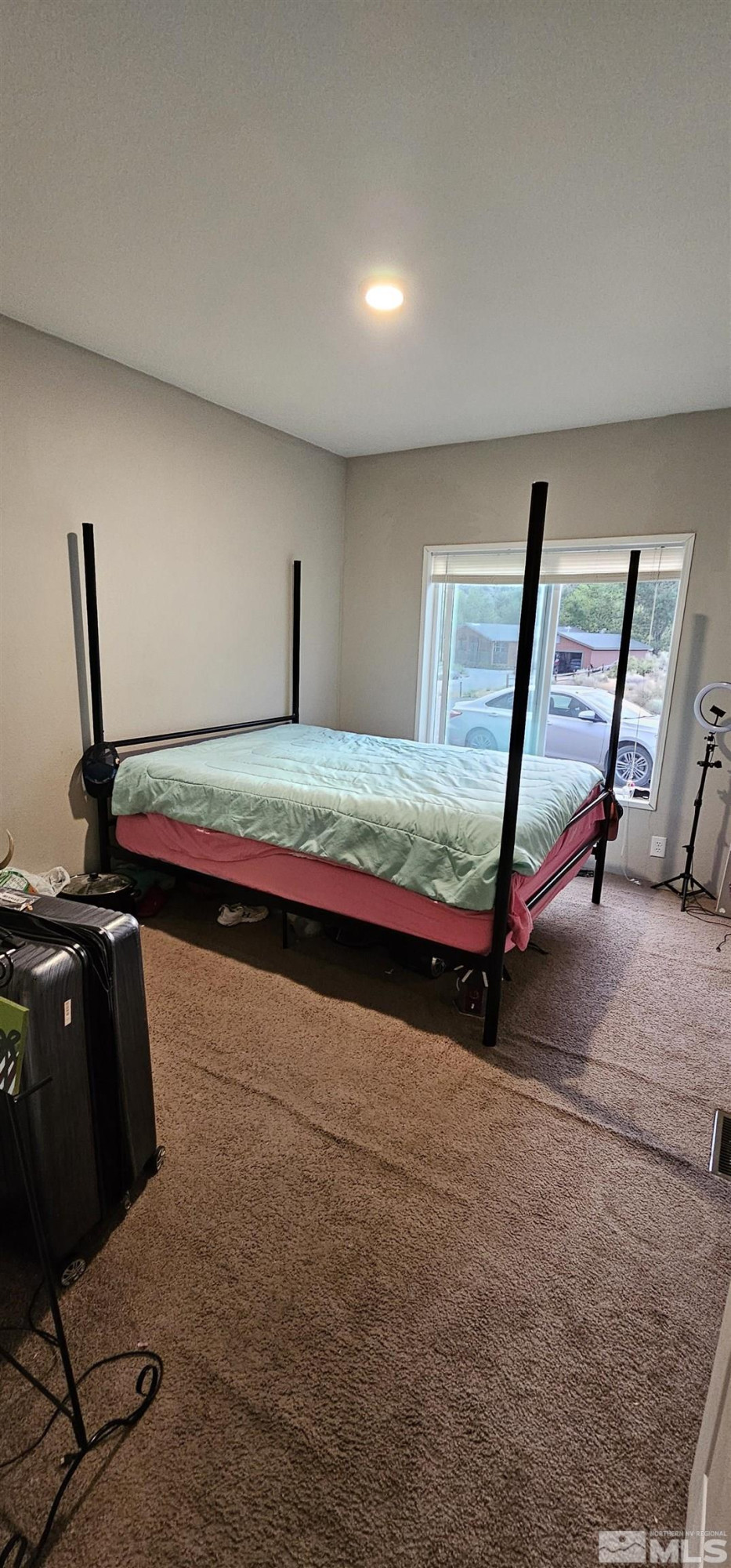 116 Victorine Drive Kingston, NV 89310 - Photo 22 of 25 a bedroom with bed and window