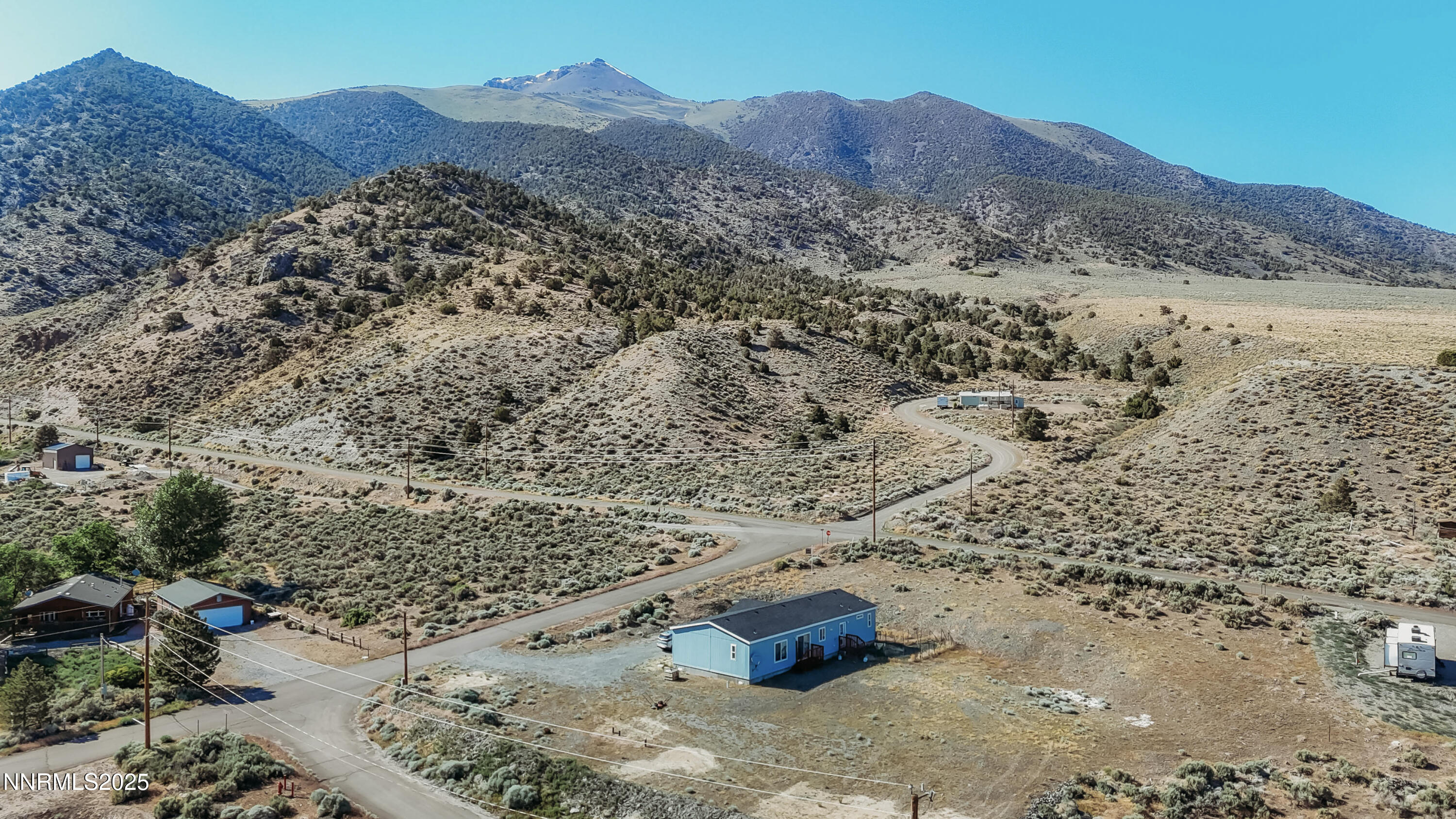 116 Victorine Drive Kingston, NV 89310 - Photo 6 of 25 a view of a dry yard with wooden fence