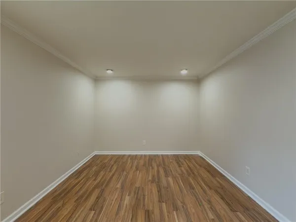 a view of room with wooden floor