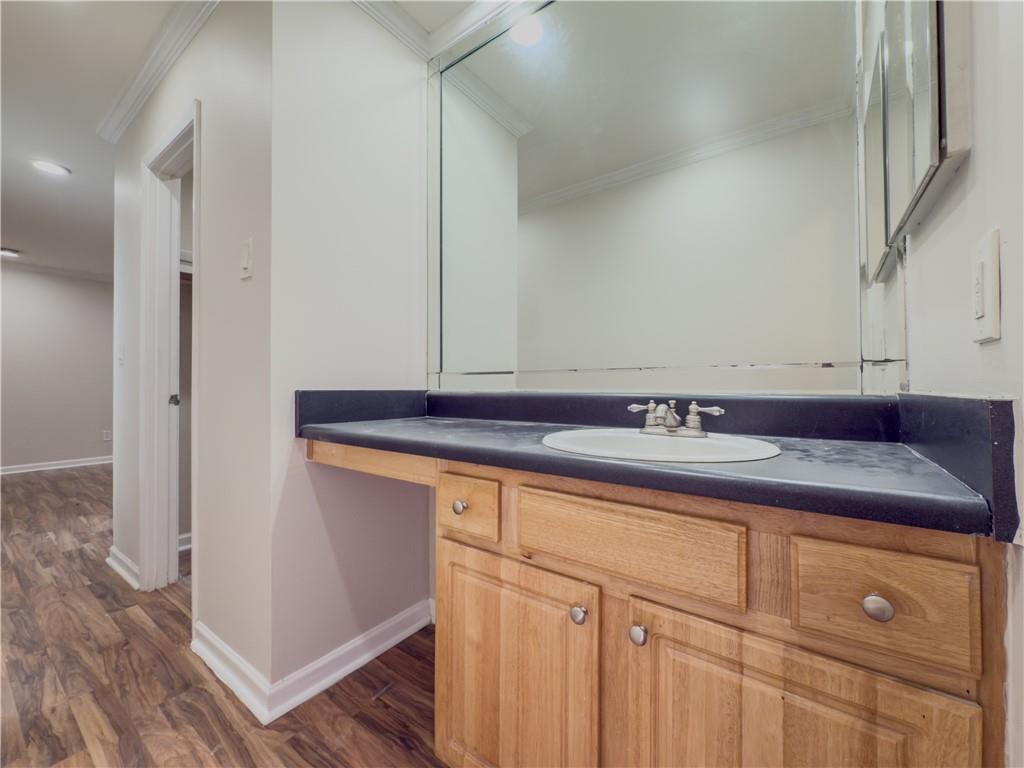 3301 Henderson Mill Road, Unit D3 Atlanta, GA 30341 - Photo 14 of 32 a bathroom with a sink and a mirror