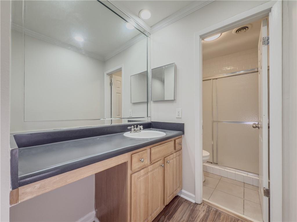 3301 Henderson Mill Road, Unit D3 Atlanta, GA 30341 - Photo 15 of 32 a bathroom with a sink and a mirror