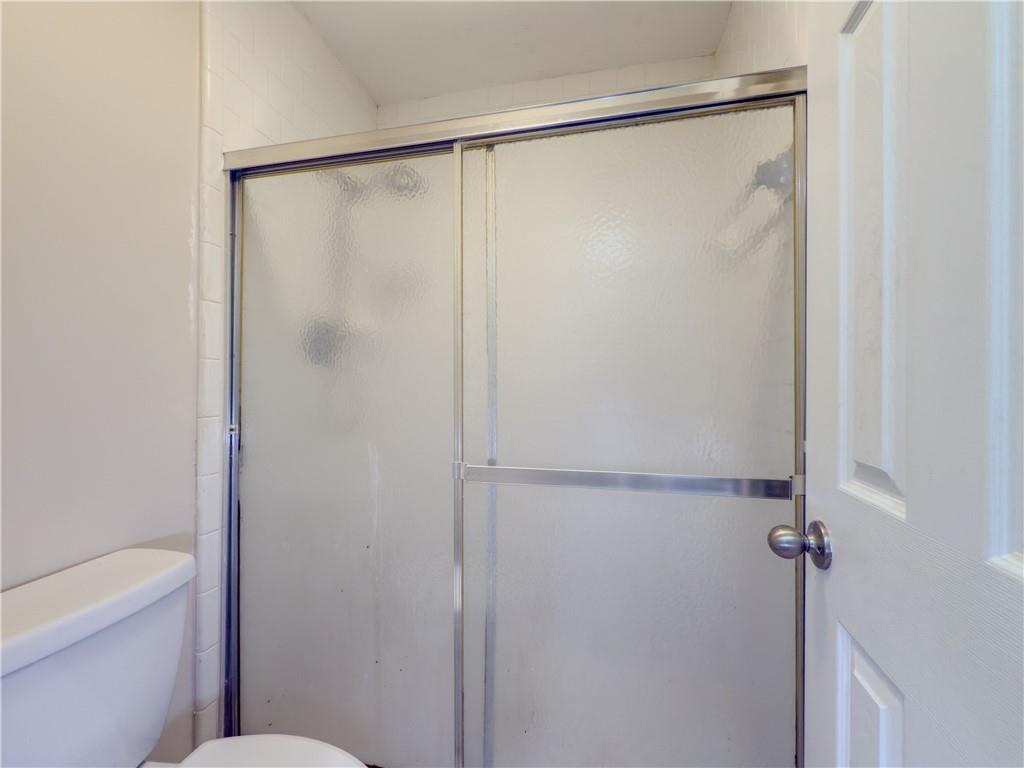 3301 Henderson Mill Road, Unit D3 Atlanta, GA 30341 - Photo 16 of 32 a bathroom with a glass shower door