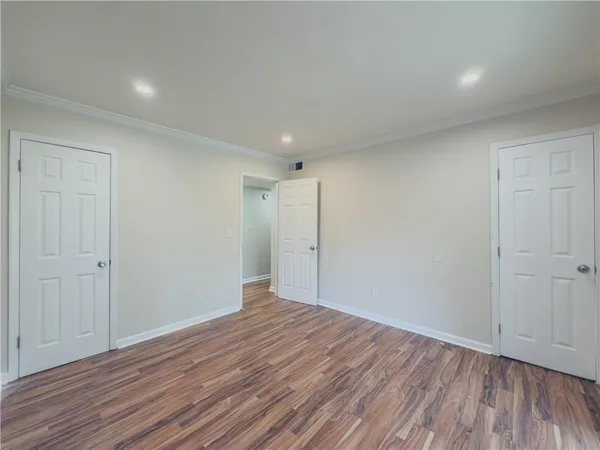 a view of room with wooden floor