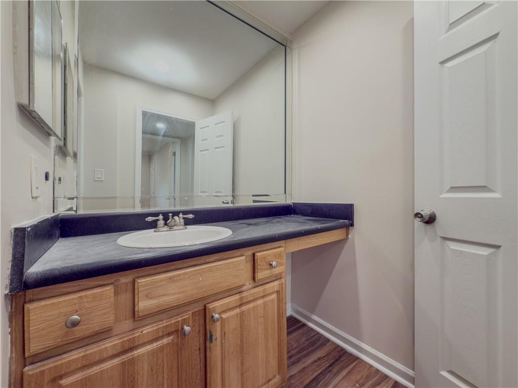 3301 Henderson Mill Road, Unit D3 Atlanta, GA 30341 - Photo 21 of 32 a bathroom with a sink and a mirror