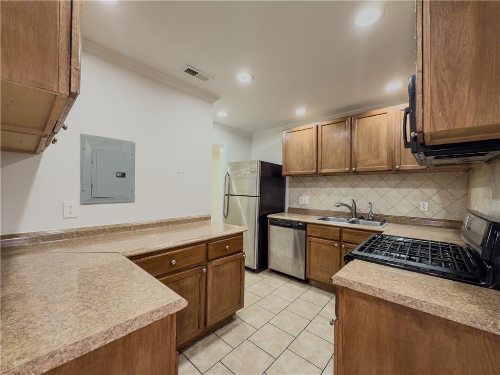 3301 Henderson Mill Road, Unit D3 Atlanta, GA 30341 - Photo 8 of 32 a kitchen with stainless steel appliances granite countertop a stove a sink and a refrigerator