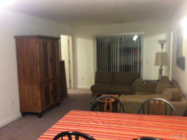 a bedroom with a bed and a mirror