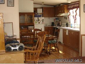 766 Patterson Mill Road Grottoes, VA 24441 - Photo 3 of 7 a kitchen with stainless steel appliances granite countertop a refrigerator and a stove
