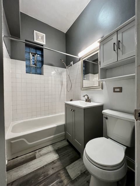 Undisclosed Address Chicago, IL 60647 - Photo 18 of 31 a bathroom with a toilet and a shower