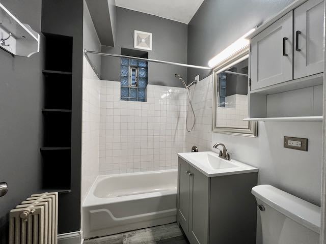 Undisclosed Address Chicago, IL 60647 - Photo 19 of 31 a bathroom with a sink a toilet and shower