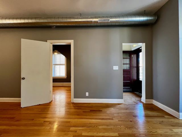 Undisclosed Address Chicago, IL 60647 - Photo 5 of 31 a view of a livingroom with wooden floor and a window