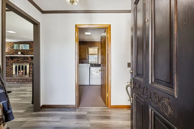 a view of a livingroom from the hallway
